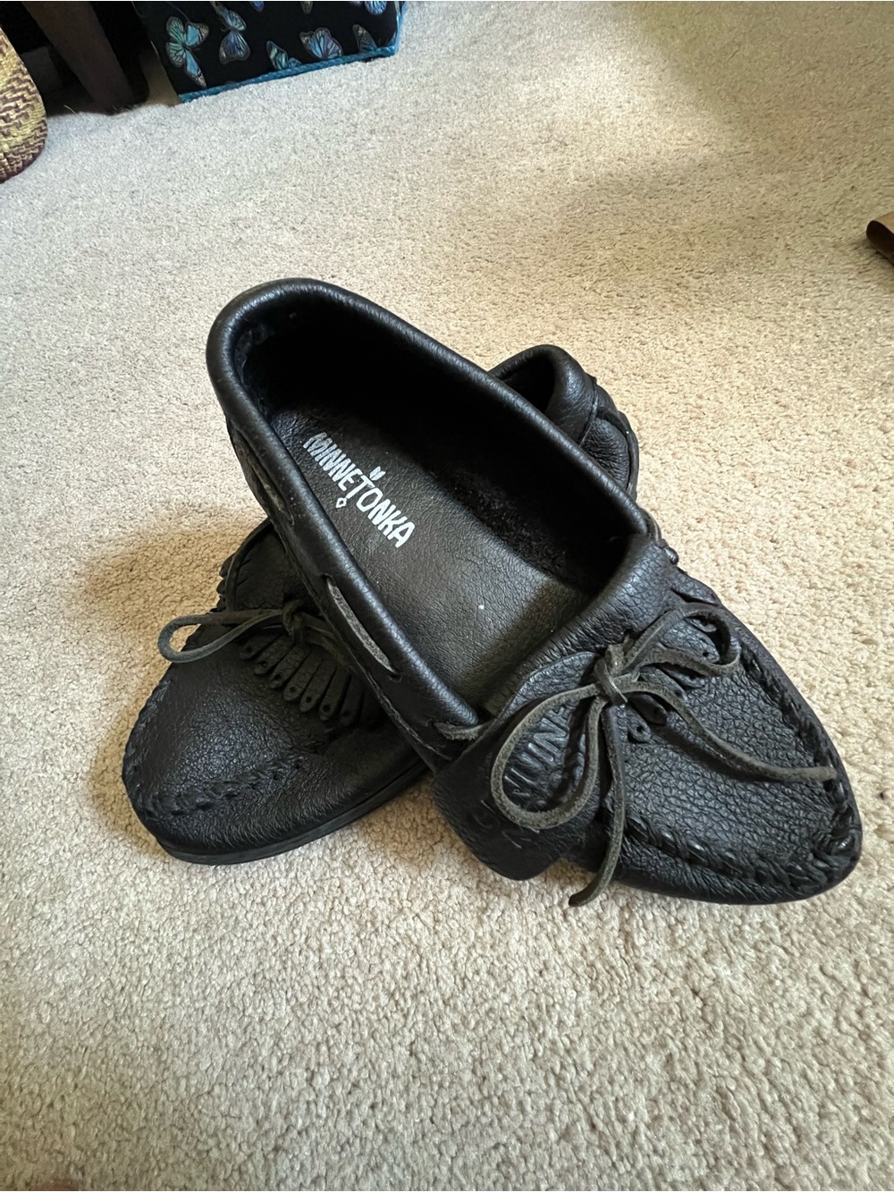 Minnetonka Black Leather Women's Moccasins with Bow & Fringe